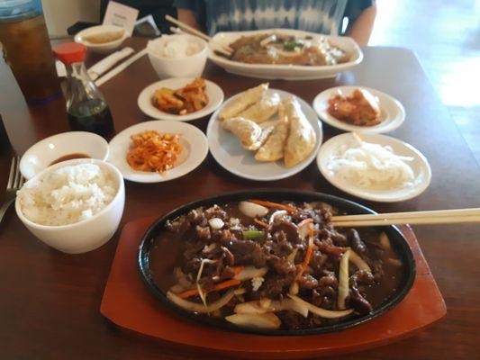 Bulgogi (marinated beef and veggies - front); Yakimandu (fried dumplings - center); Japchae (glass noodles with marinated beef - back).