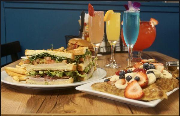 Club sandwich and Berries and Bananas French toast