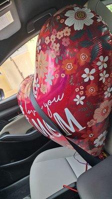 Big balloon for mother's day gets a seat belt ride