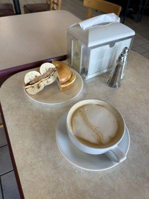 Bagel with egg and meat , coffee