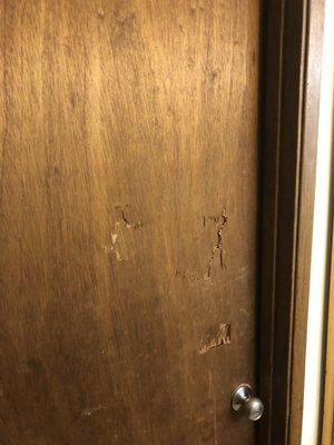 Damage to bathroom door like someone was trying to break into bathroom