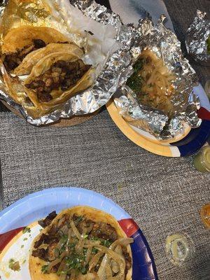 Fajita and pastor tacos with the grilled onions and cilantro they give you