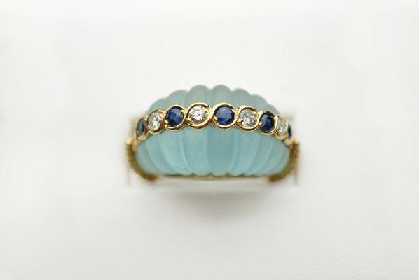 Beautiful estate ring Featuring sea glass, sapphires and diamonds.