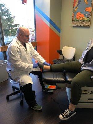 Dr. Lind working with a patient in the airplane room.