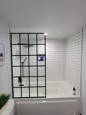 Completed Condo bath remodel with new custom printed glass shower.