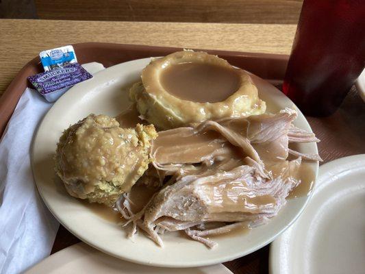 Turkey dinner plate with dressing and mashed potatoes