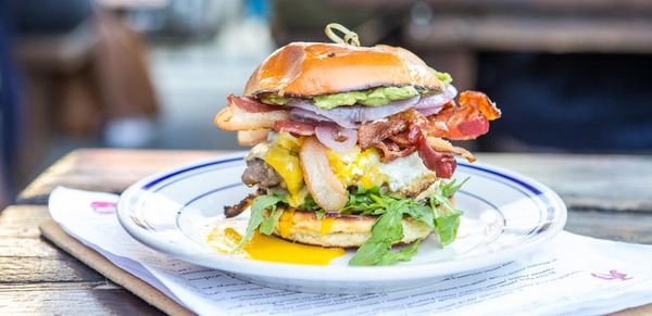 The Proper Burger - fully loaded with Applewood Smoked Bacon, Smashed Avocado and Runny Egg!