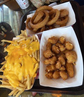 Family portions of cheese fries, cheese curds, and onion rings