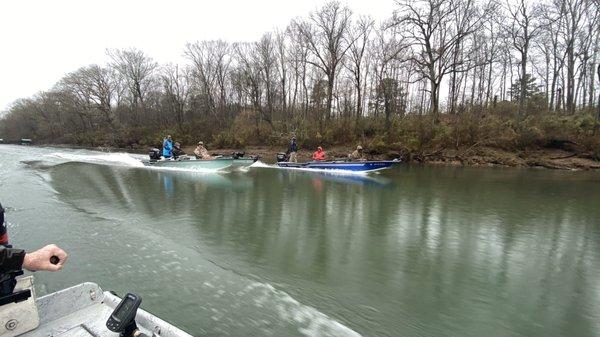 Boys racing boats back for lunch