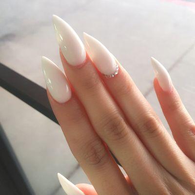 Soft white with stiletto shape and gems on ring fingers.