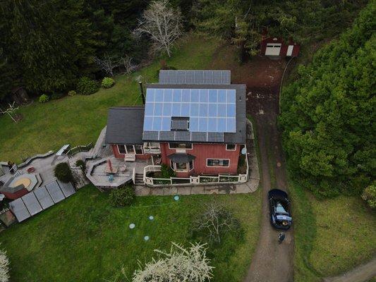 Roof mount solar array with elevated racking system on the north face