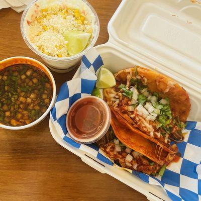 Birria tacos w/ consumme and elote.