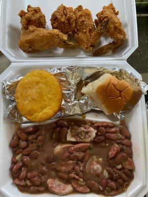 This is a #5: Chicken Wings with Red Beans & Rice, which includes a Roll and Corn Muffin.