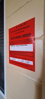 Stop work order on the door.