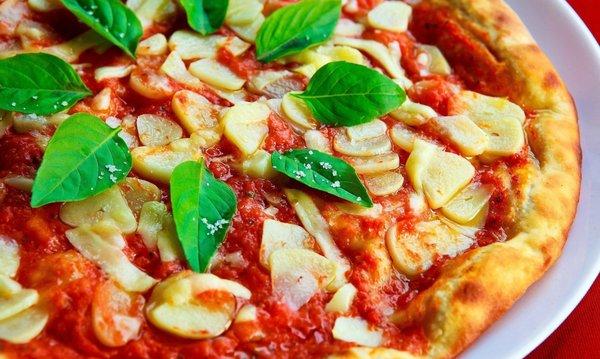 Garlic pizza with basil.