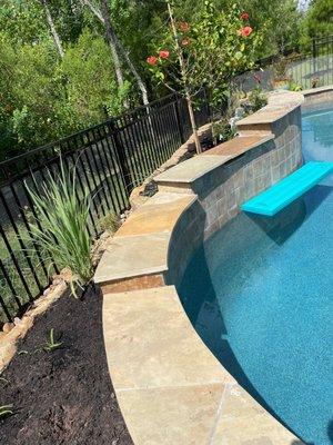 Behind pool planter bed