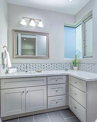 Light Gray Shaker Cabinets with Calacatta White Quartz Countertops.