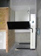 Wheelchair lift in garage. Easy transfer from garage to entrance