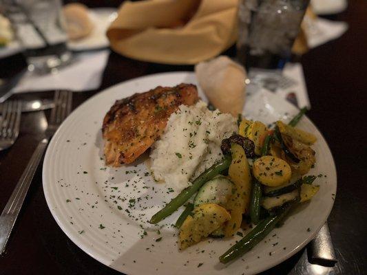 Salmon with whipped mashed potatoes and veggies.