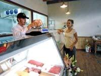 Butcher Christopher Galasso serves a customer at the Walla Walla butcher shop.