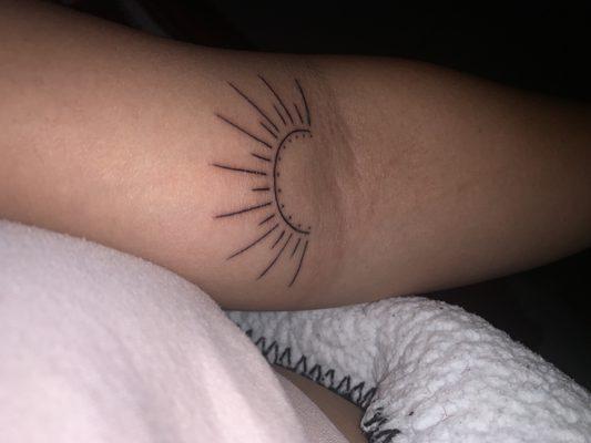 Sun tattoo done by Francis