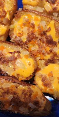 %trinity Potatoes. baked the fried. Topped with american cheese-onion-green peppers and real bacon pieces. Yummy.