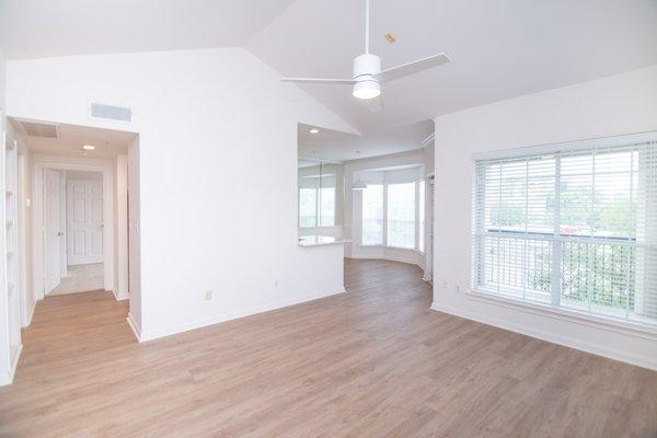 Whitney at the Heights Living Area With Natural Wood Like Flooring