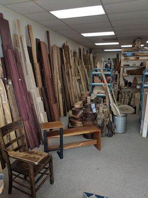 South wall of store facing west.  Selection of exotic and domestic hardwood seen with bowl blanks and small crafted items as well.