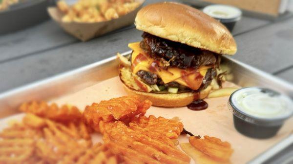 Brisket burger with honey drizzled sweet potato, waffle fries