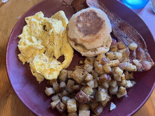 Scrambled eggs, home-fries with added onion, English Muffin and bacon