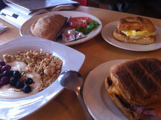 Pasties (meat and potato pastry), egg, cheese and ham/bacon croissant, and yogurt topped with granola, almonds, and berries