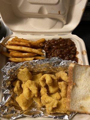 Catfish Nuggets Dinner, fries, baked beans and bread.