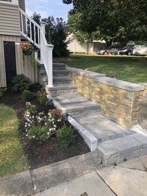 Front walkway with pavers, stone stairs & veneer stone retaining wall. Added 2 new steps .