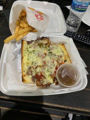 Italian beef and sausage combo with red sauce,  giardiniera peppers, and juice on the side.