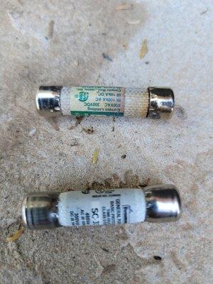 A good time delay fuse vs a bad one. Notice the burnt end on the top fuse.