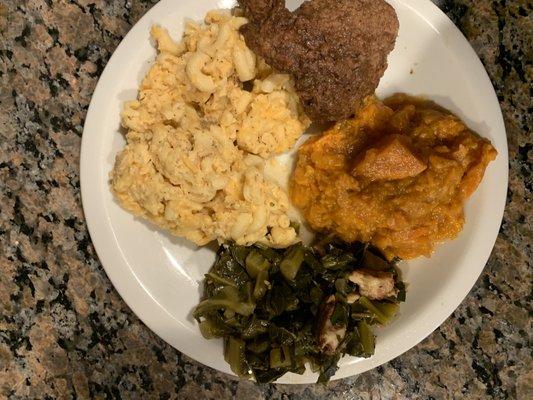 Smothered chicken, greens, yams, and mac and cheese