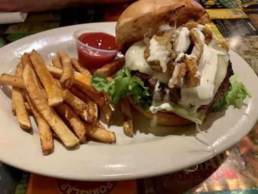 Burger topped with fried pickles and banana peppers - yum!