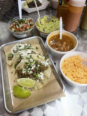 Steak tacos on corn tortillas. Rice beans pico de Gallo and homemade guac.