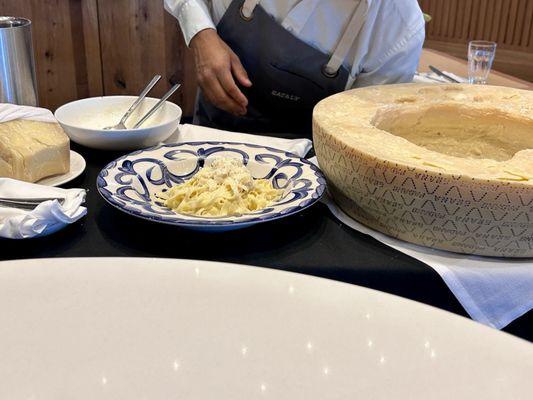 The fettuccine was made inside the cheese wheel