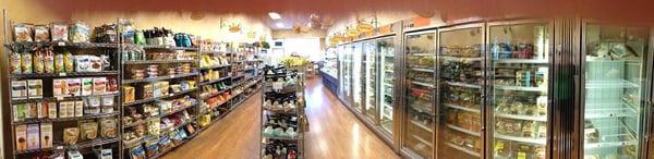 View of dry goods and partial freezer case and partial refrigerated area.