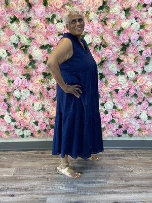 Mom posing in front of flower wall