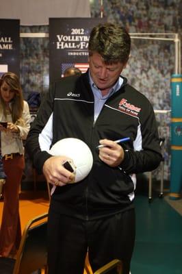 Jeff Stork autographing a ball during Induction Weekend 2012