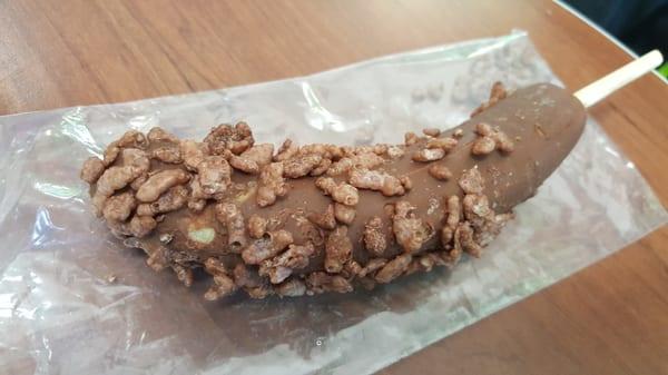 Frozen chocolate banana rolled in Chococrispies