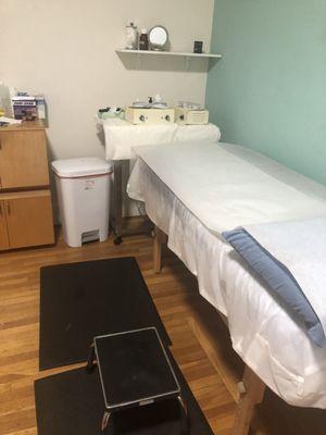 Private and comfortable waxing room with natural light.