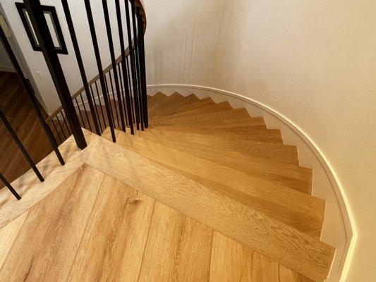 Transition from LV flooring to the solid white oak staircase