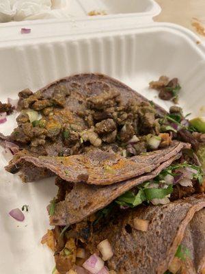 Carne asada, pollo and Al pastor tacos. Organic blue corn tortillas.