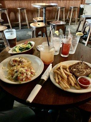 Fish tacos with veggies (L) & fries with a sandwich