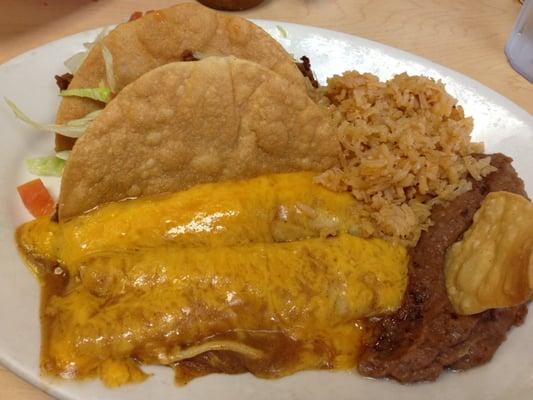 Mexican Plate - two enchiladas and two crispy tacos with a serving of rice and beans.