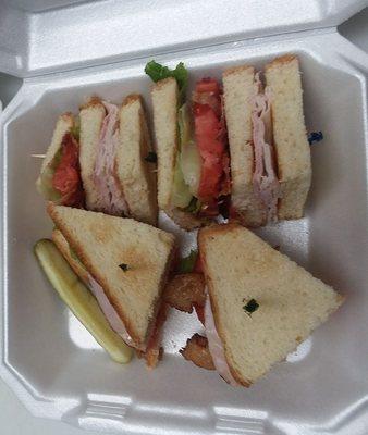 Club sandwich so big takes up entire large to go box.