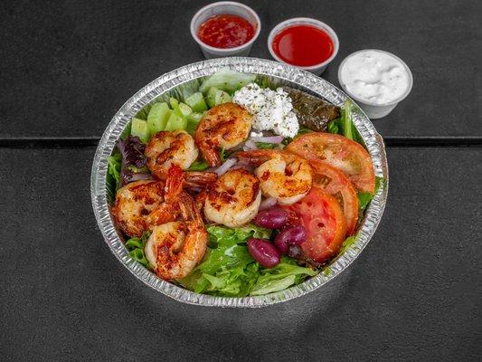 Grilled jumbo shrimp over Greek salad fresh to order